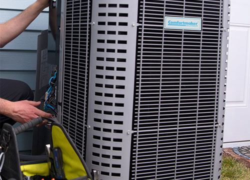 A Technician Inspects An HVAC System